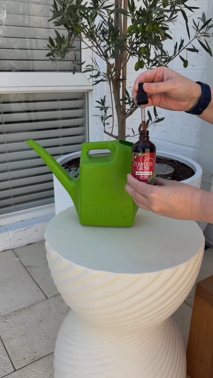 CompleteGrow Indoor Plant Food being prepared for watering indoor plants